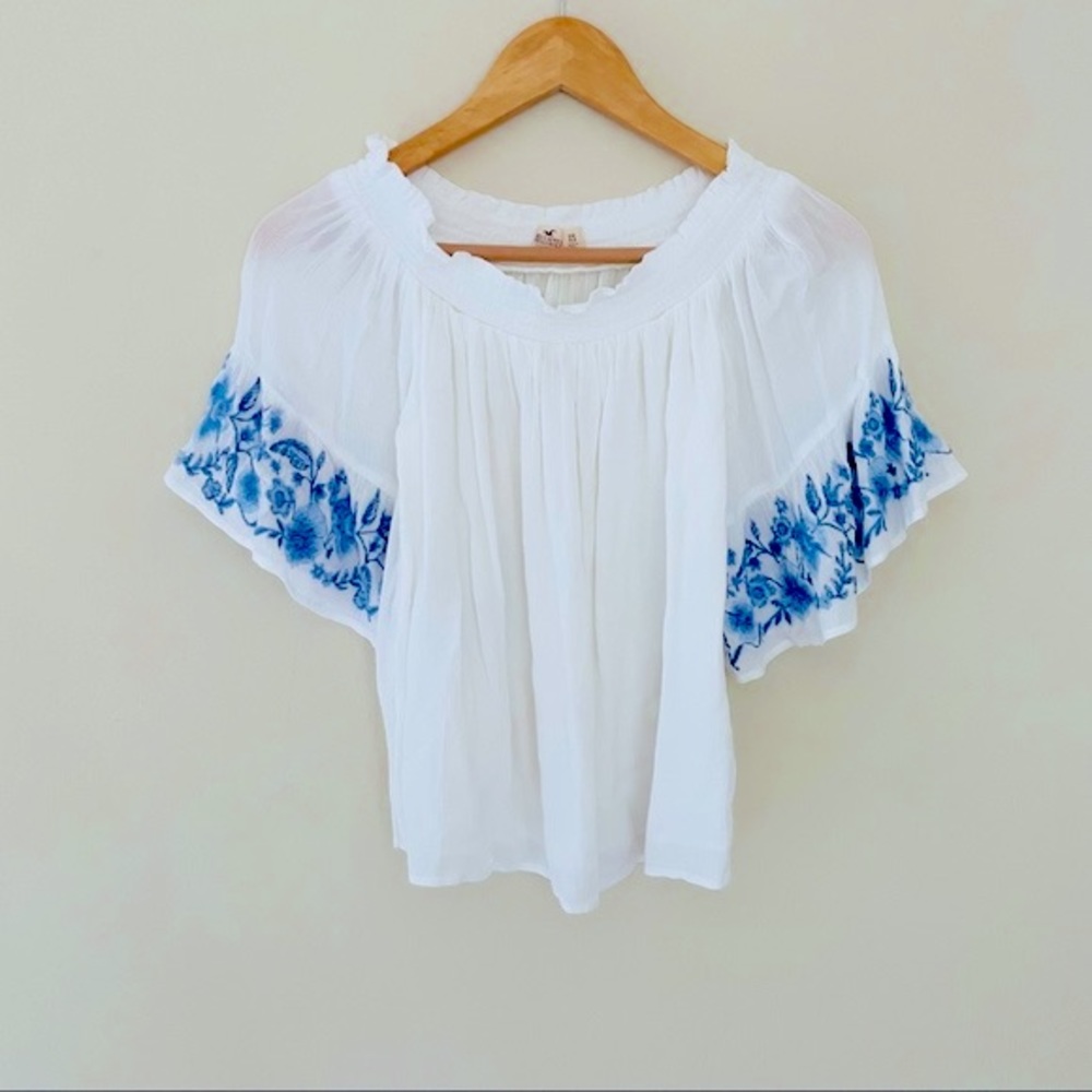 Off shoulder top with floral embroidery bell sleeves